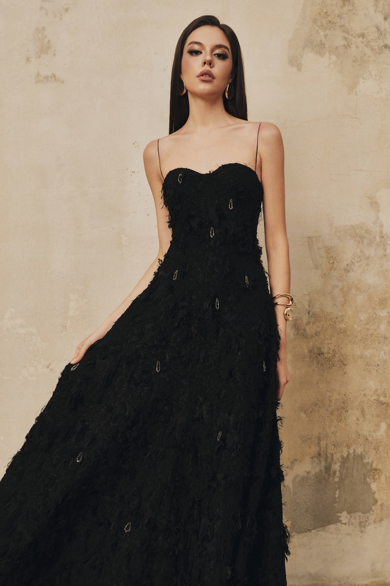 Black A-line spaghetti-strap midi dress with crystal beading from L'SCARLETT, perfect for elegant occasions.