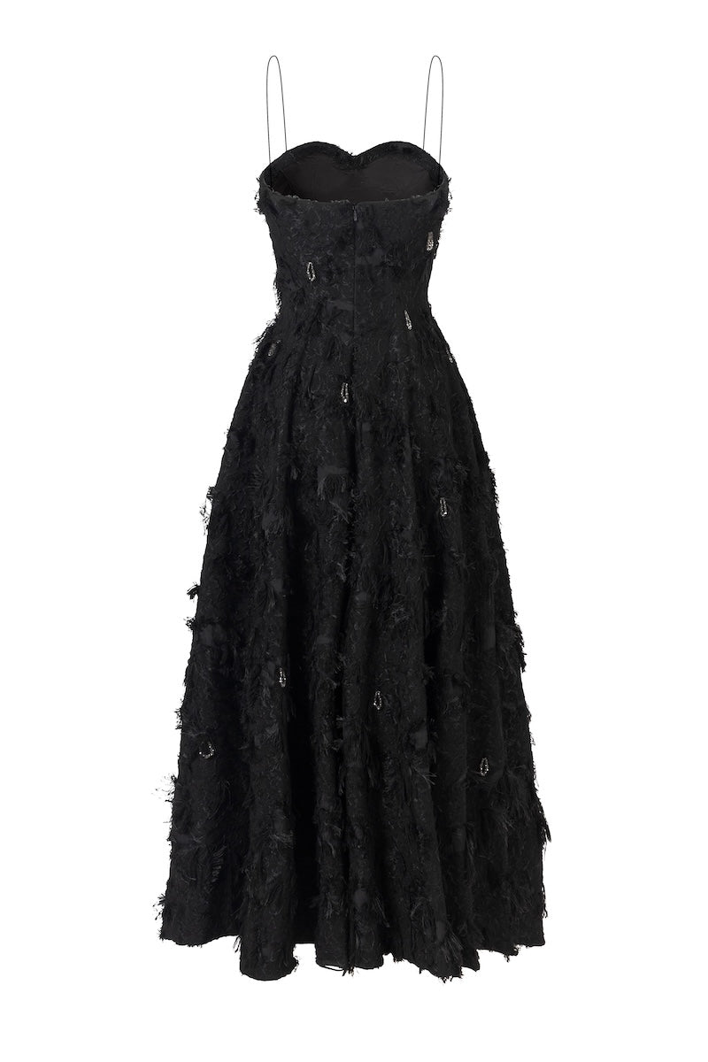 Black L'Scarlett A-line spaghetti-strap midi dress with crystal beading, shown from the back. Elegant evening dress for formal occasions.