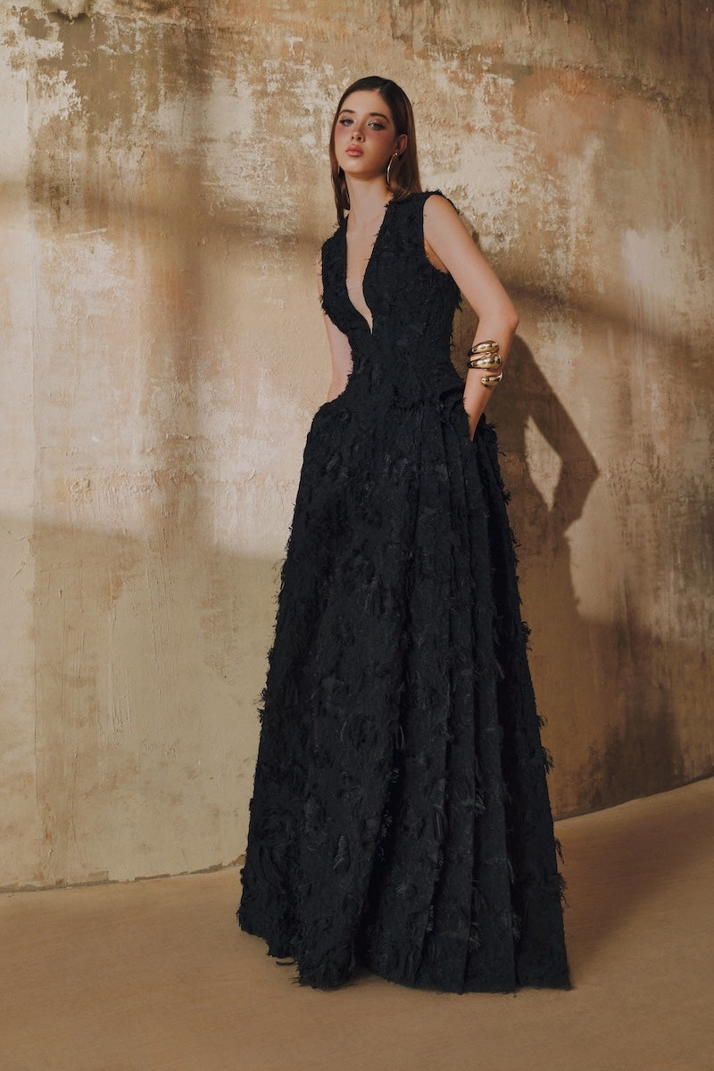 Black sleeveless V-neck maxi dress with fringe and layered side panels by L'SCARLETT, featuring jacquard fabric design.