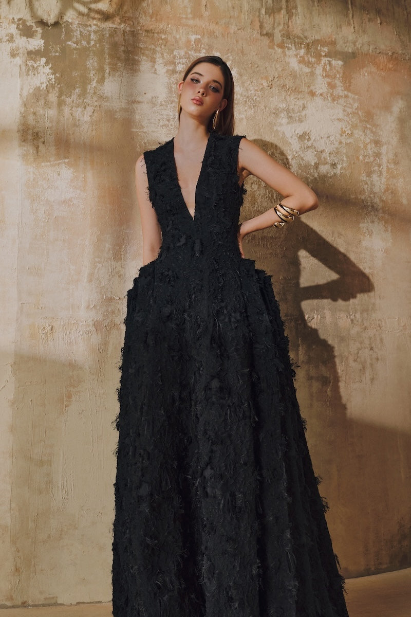 Black sleeveless V-neck fringe jacquard layered-side-panel maxi dress by L'SCARLETT, displayed with flowing fabric and intricate design.