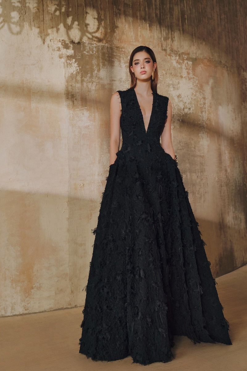 Black sleeveless V-neck maxi dress with fringe and jacquard fabric, layered side panels, by L'SCARLETT.