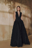 L'SCARLETT sleeveless v-neck jacquard gown with layered side panels, elegant design, and intricate fabric details.