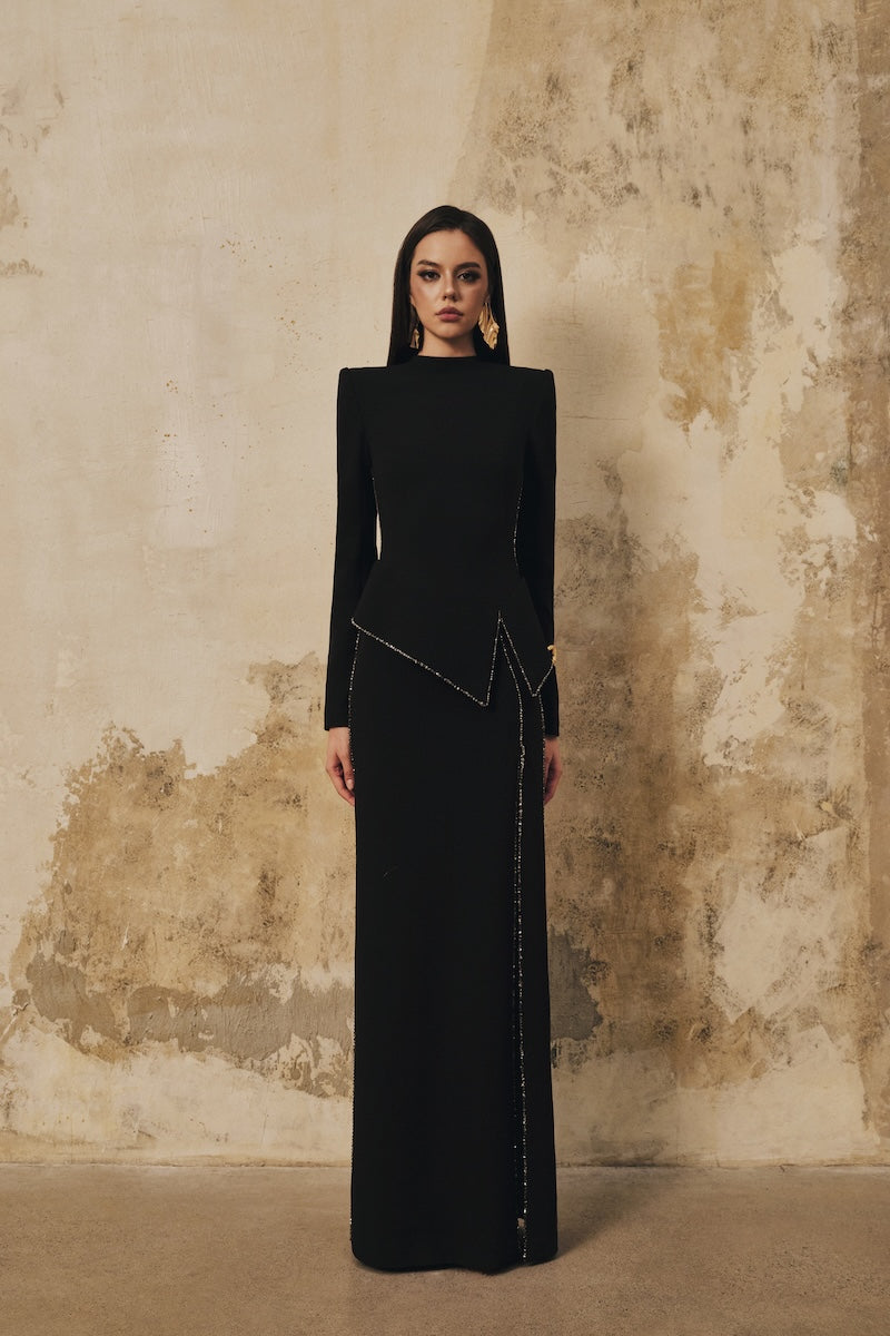 Black L'SCARLETT peplum high-neck maxi dress with long sleeves, crystal beading and front slit, elegant evening gown.