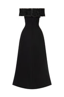 Black flared draped-neckline off-shoulder beaded gown by L'SCARLETT, showcasing elegant draping and intricate beadwork from the back.