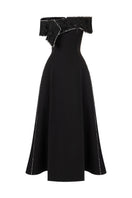 Black flared beaded gown by L'SCARLETT with draped neckline and off-shoulder design, shown from the front.