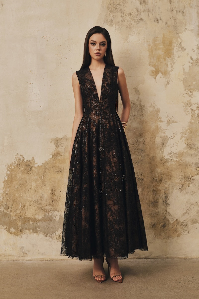 Black sleeveless midi dress by L'SCARLETT featuring a flared V-neckline, 3D floral crystal embellishments, perfect for elegant occasions.