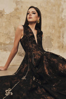 L'SCARLETT sleeveless flared gown with V-neckline and 3D crystal floral embellishments, elegant evening wear.