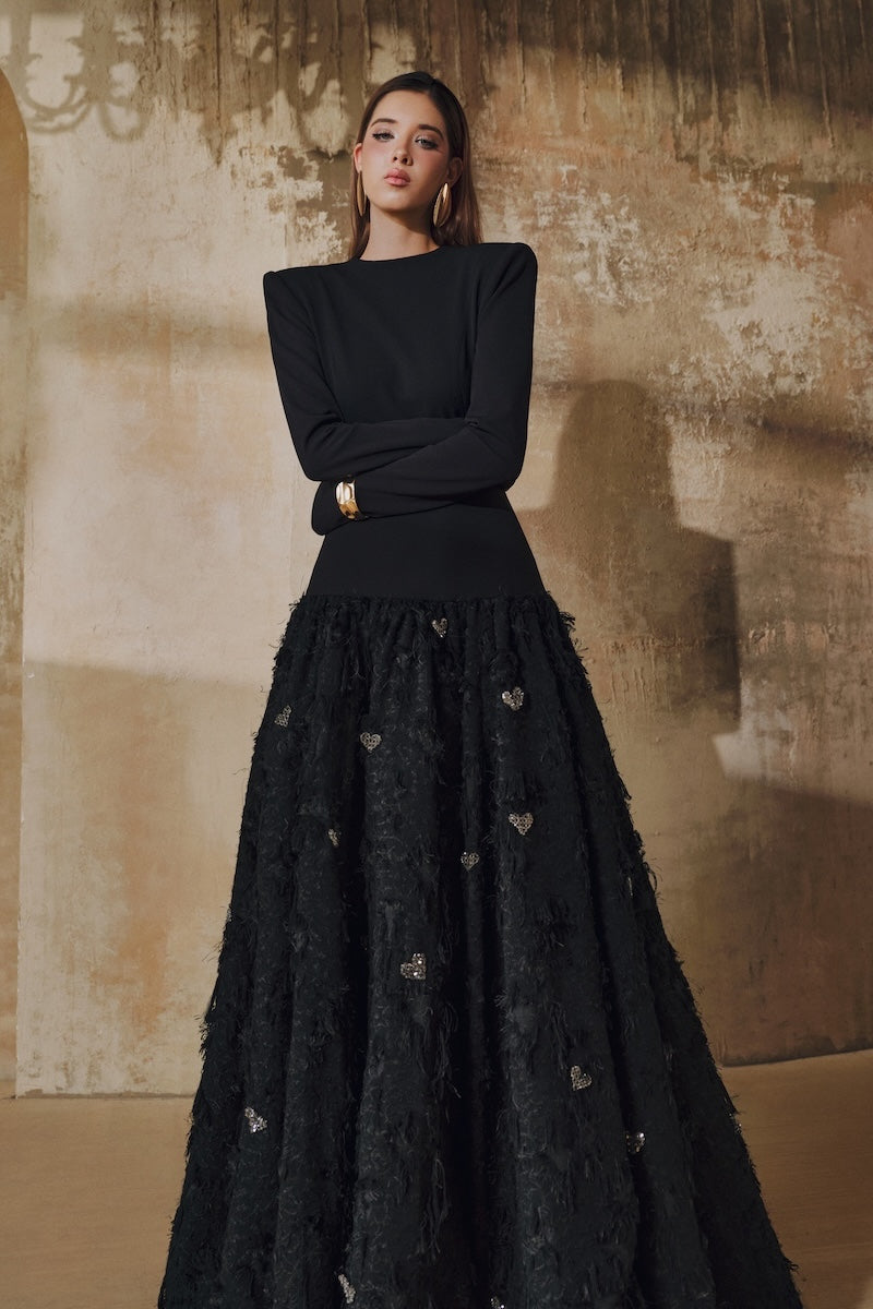 Black L'SCARLETT maxi dress with round neck, open back, hand-embellished crystal heart design, elegant and flowing.