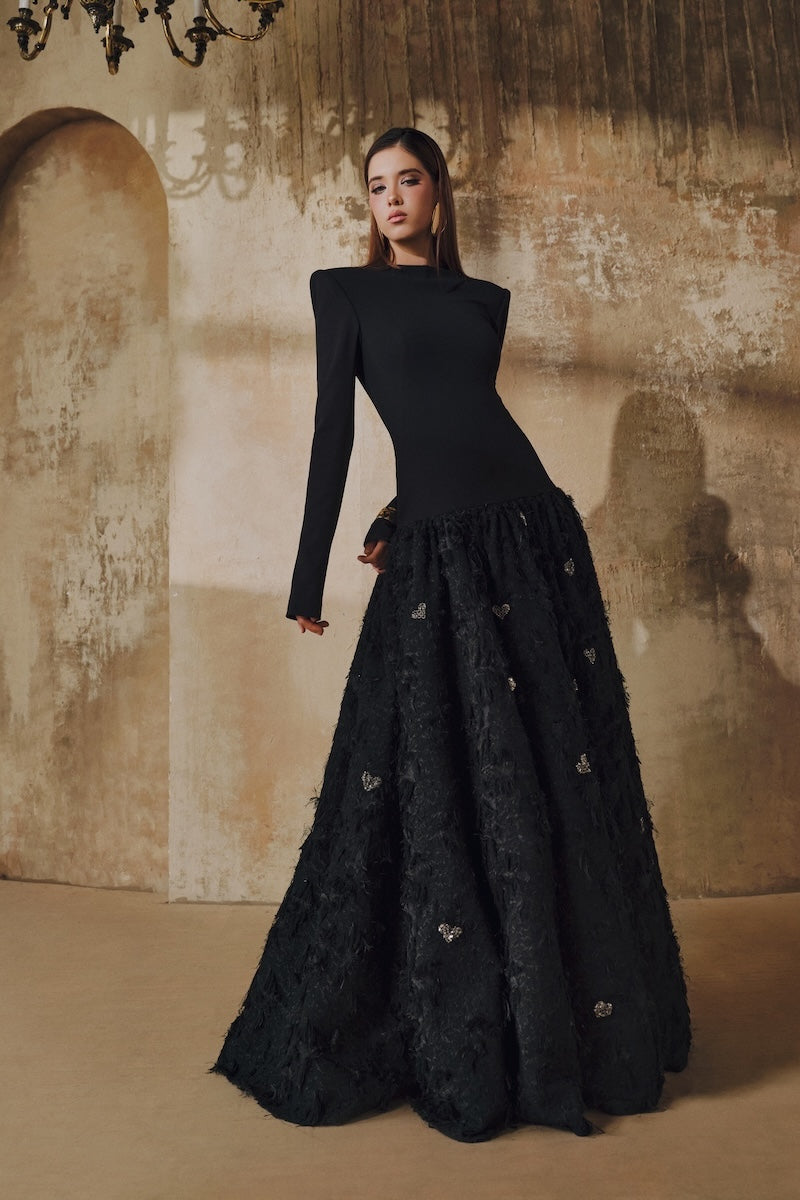 Black maxi dress by L'SCARLETT featuring a round neck, open back, hand-embellished crystal heart details.