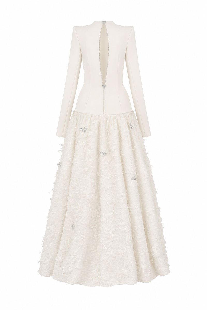 Off-white L'Scarlett maxi dress with round neck, open-back design, and crystal heart detail, perfect for elegant occasions.