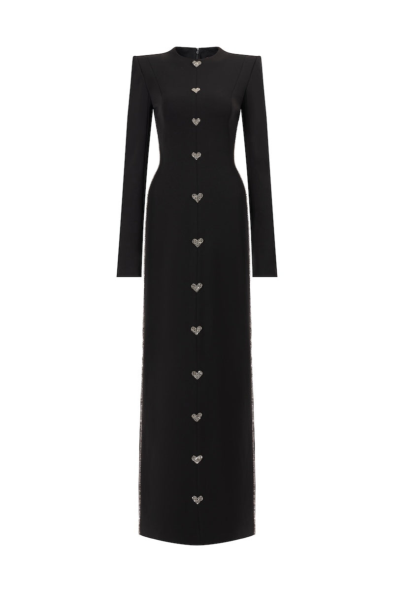 Black L'SCARLETT maxi dress with straight cut, long sleeves, hand-embellished crystal heart design, front view.