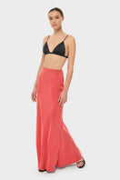 NiLuu AquaFlora Lucy slip skirt in coral, maxi style with flowy fabric and elastic waistband, shown on a model.