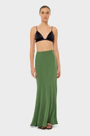 A niLuu AQUAFLORA Lucy slip skirt in moss green, maxi length with a flowy design, shown on a model.