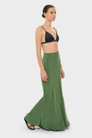 NiLuu AQUAFLORA Lucy slip maxi skirt in moss green fabric with a flowing design and subtle slit detail.