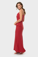 NiLuu Lucy slip skirt in rouge color, a flowy maxi skirt with a smooth fabric and elegant design, shown in the image.
