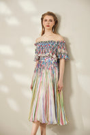 Le Thanh Hoa multicolor floral midi dress with vibrant print, flowing fabric, and elegant design for stylish summer wear.