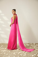 Le Thanh Hoa luminous halter gown with elegant design, featuring flowing fabric and stylish details for formal occasions.