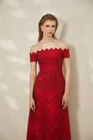 Elegant Scarlet Diamond Gown by Le Thanh Hoa featuring intricate detailing and flowing fabric, perfect for formal occasions.