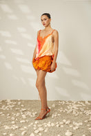 Le Thanh Hoa taffeta mini skirt in a stylish design, shown in a detailed lookbook image.