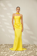 Le Thanh Hoa Canary Gown featuring elegant design and flowing fabric, perfect for formal occasions.
