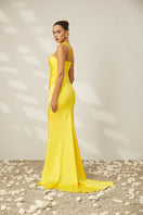 Le Thanh Hoa Canary Gown featuring elegant fabric and intricate design, perfect for formal occasions.