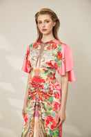 Le Thanh Hoa Indochine Bloom midi dress with floral pattern and flowing fabric, displayed on a mannequin.