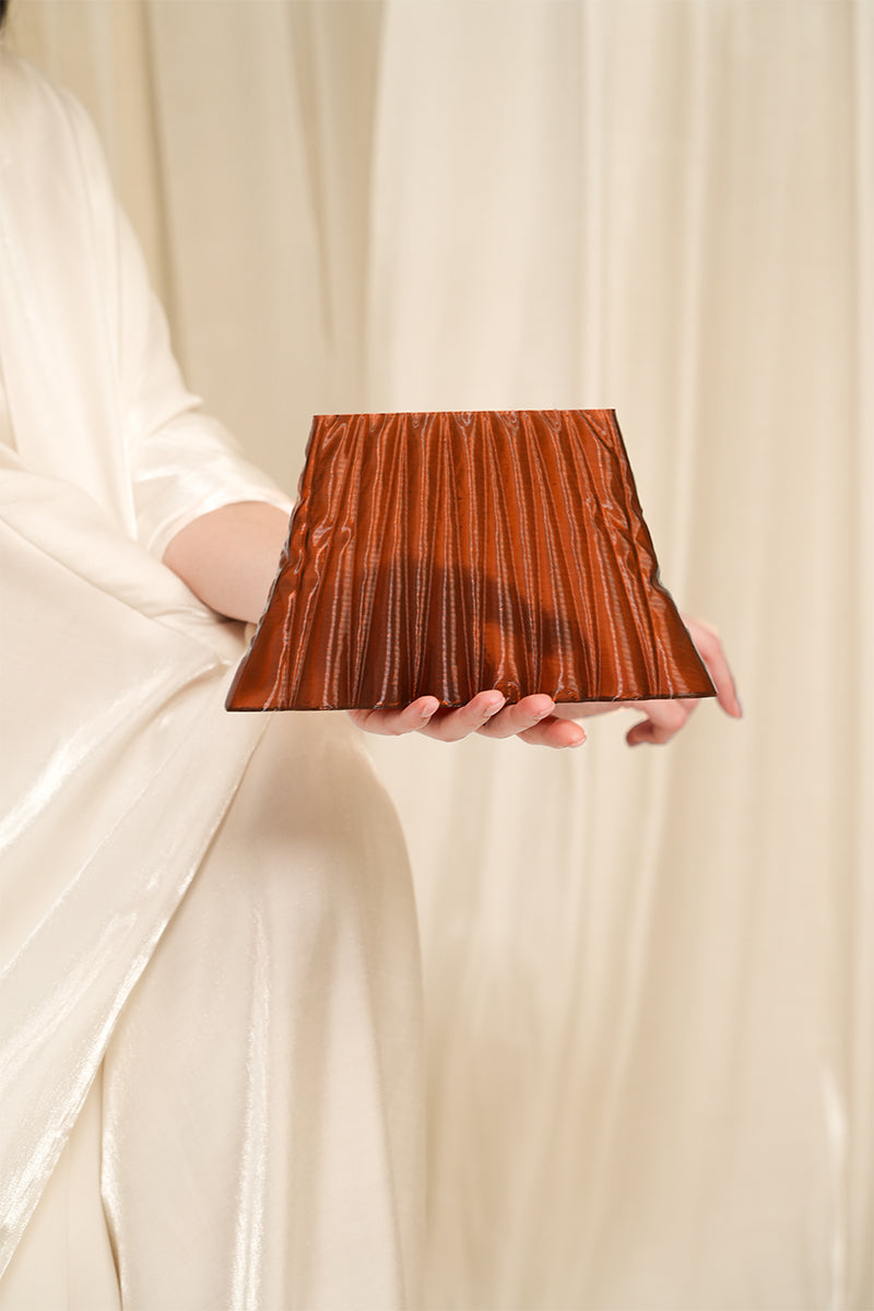 Touchless Liquid Treasures Copper clutch bag with textured metallic finish, stylish and compact accessory for evening or formal occasions.