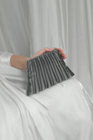 Silver clutch bag from Touchless Liquid Treasures in Silver collection, stylish and elegant accessory with metallic finish.