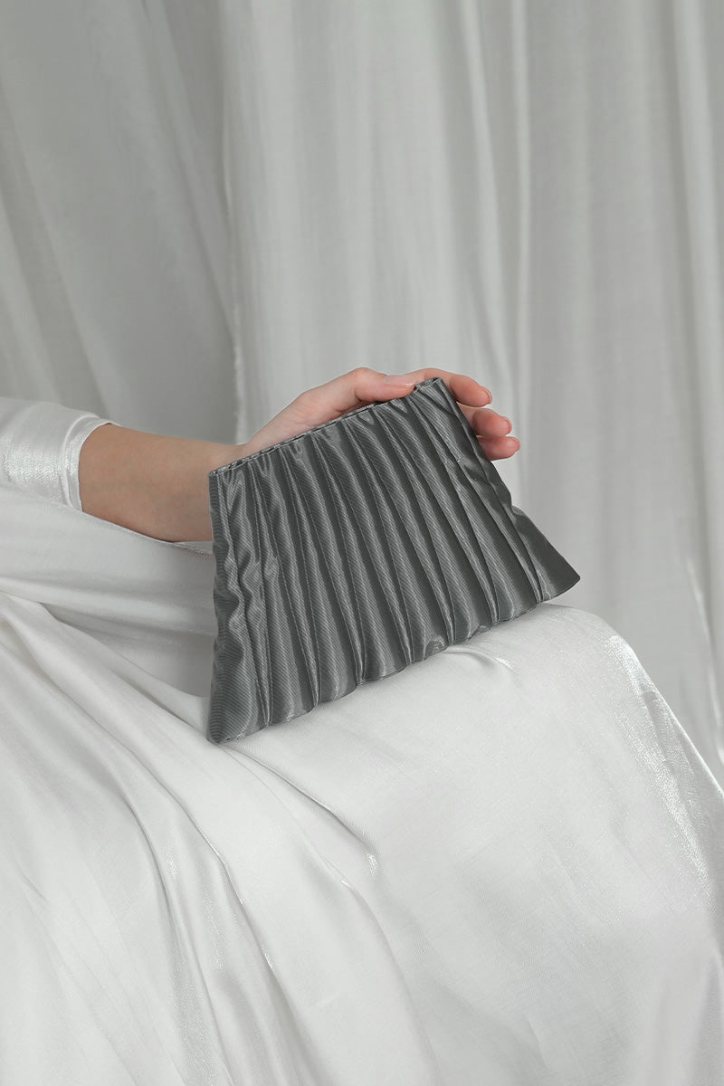 Silver clutch bag from Touchless Liquid Treasures in Silver collection, stylish and elegant accessory with metallic finish.