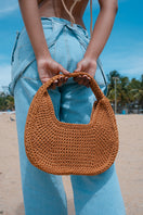 Mara Brazil LUA shoulder bag in vibrant color, featuring a sleek design with a top handle and adjustable shoulder strap.