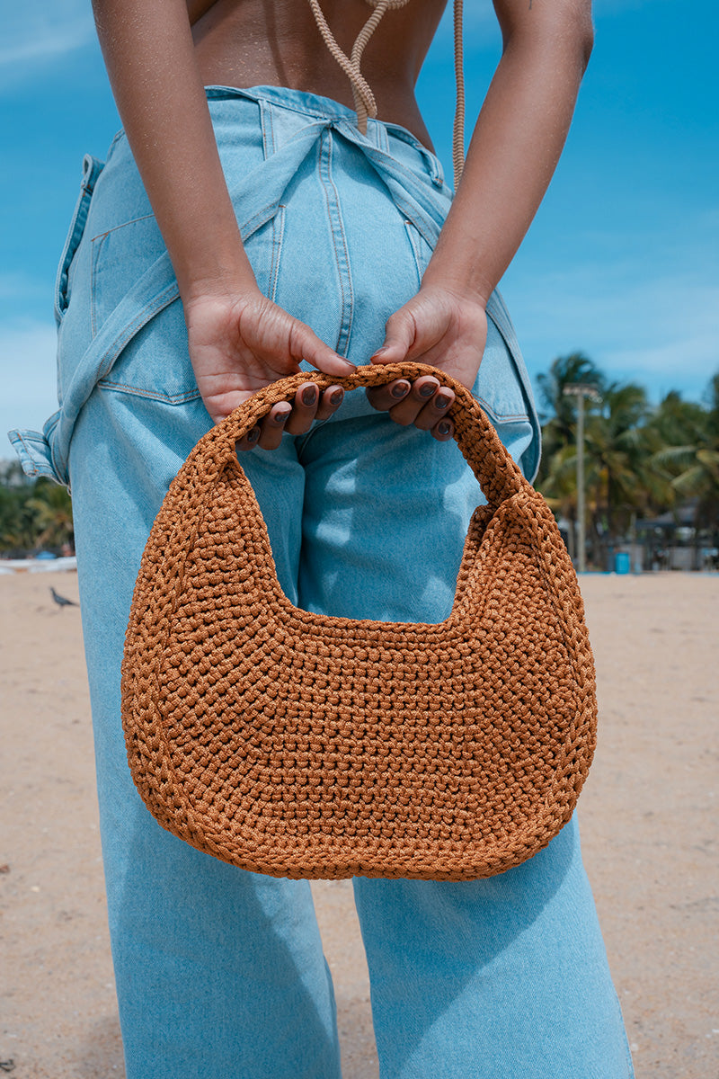 Mara Brazil LUA shoulder bag in vibrant color, featuring a sleek design with a top handle and adjustable shoulder strap.