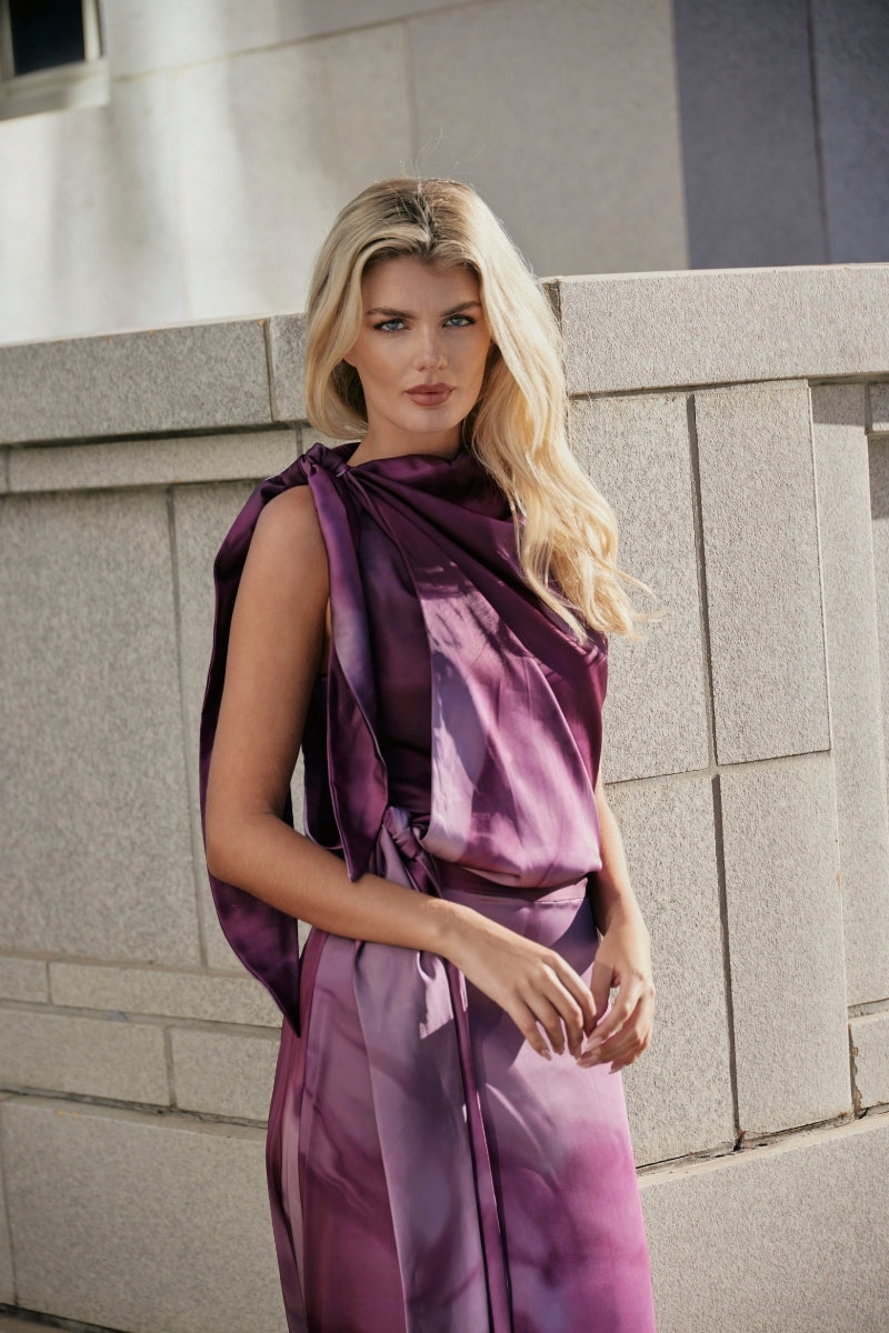 Purple printed Lumara blouse by Tinta Latina, stylish tops with vibrant floral design, shown on a model.