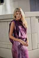 Purple printed Lumara blouse by Tinta Latina, stylish tops with vibrant floral design, shown on a model.