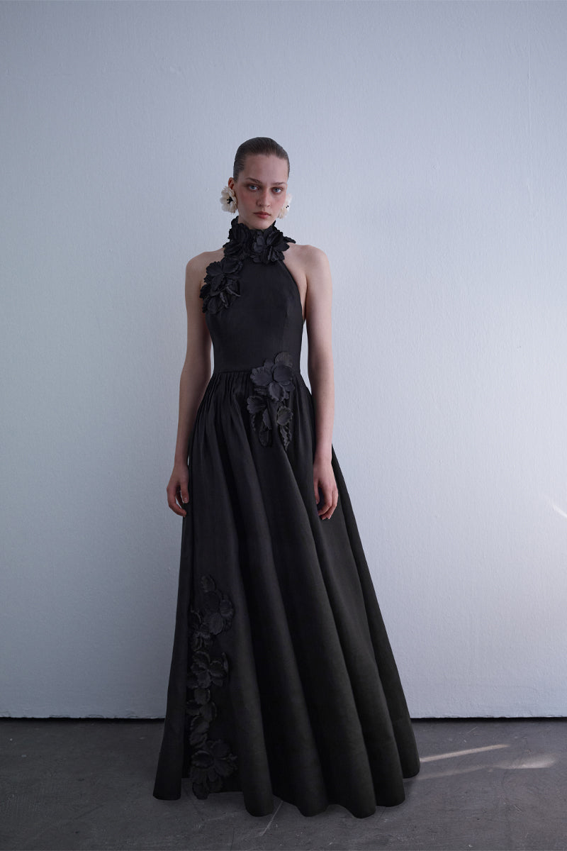 Elegant luminous gown by AISA featuring a flowing design and shimmering fabric, perfect for formal occasions.