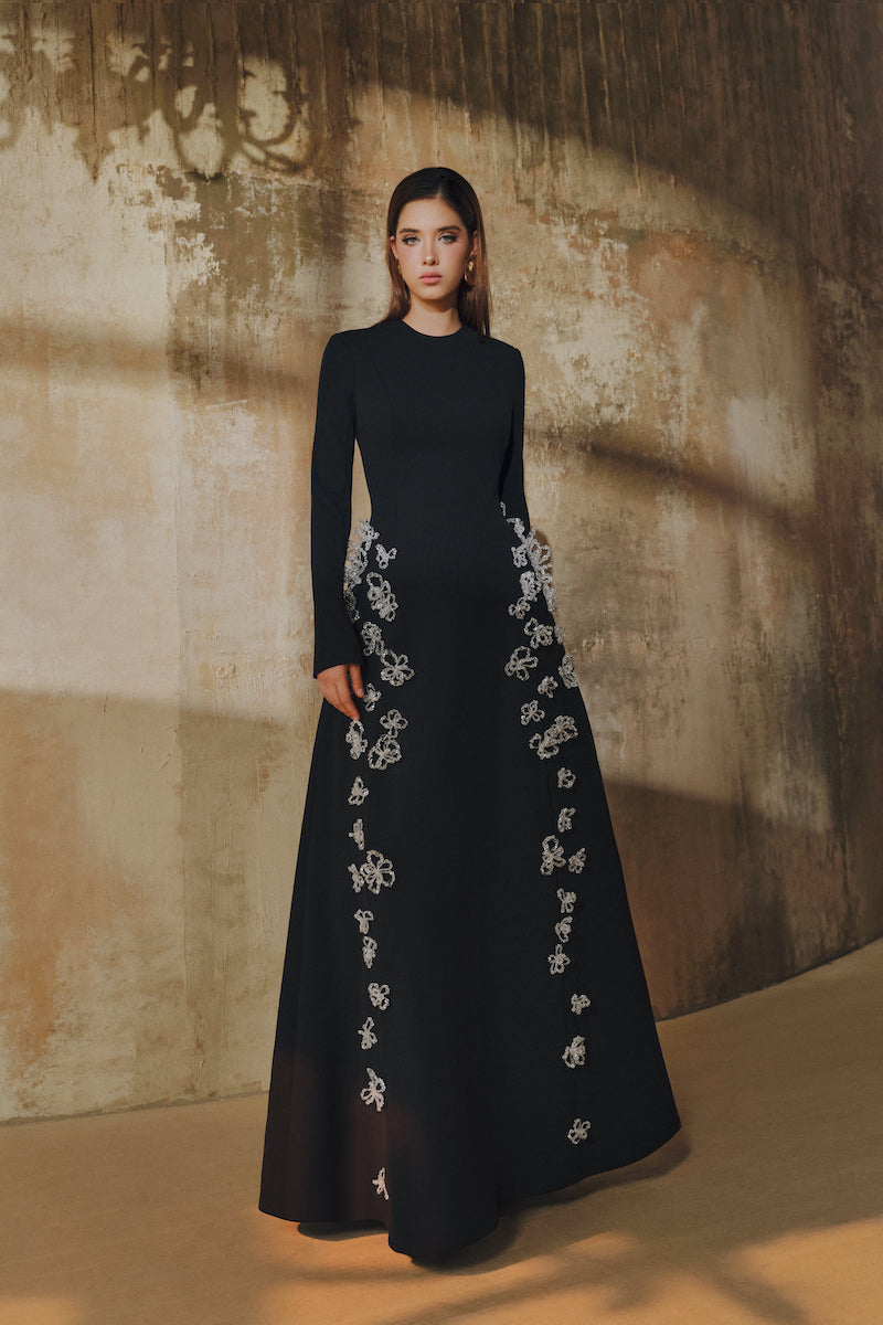 L'SCARLETT flared long-sleeve maxi dress with 3D crystal floral design, featuring a flowing silhouette and elegant style.