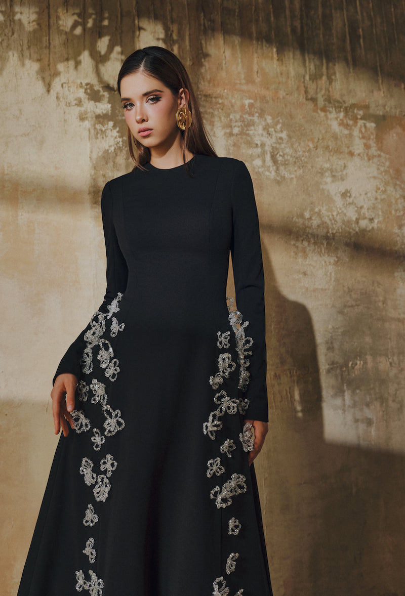 L'SCARLETT flared long-sleeve maxi dress with 3D crystal floral design, elegant and flowing for formal occasions.