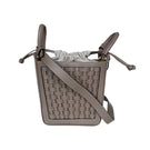 ISIDORA MALVA La Dorada Mini taupe top handle bag with sleek design and compact size, featuring a structured silhouette and top handle.