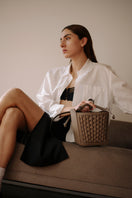 ISIDORA MALVA La Dorada Mini taupe top handle bag with sleek design and gold-tone hardware.
