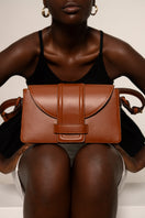 ISIDORA MALVA La Pradera tan shoulder bag with adjustable strap and spacious interior, stylish for casual or formal wear.