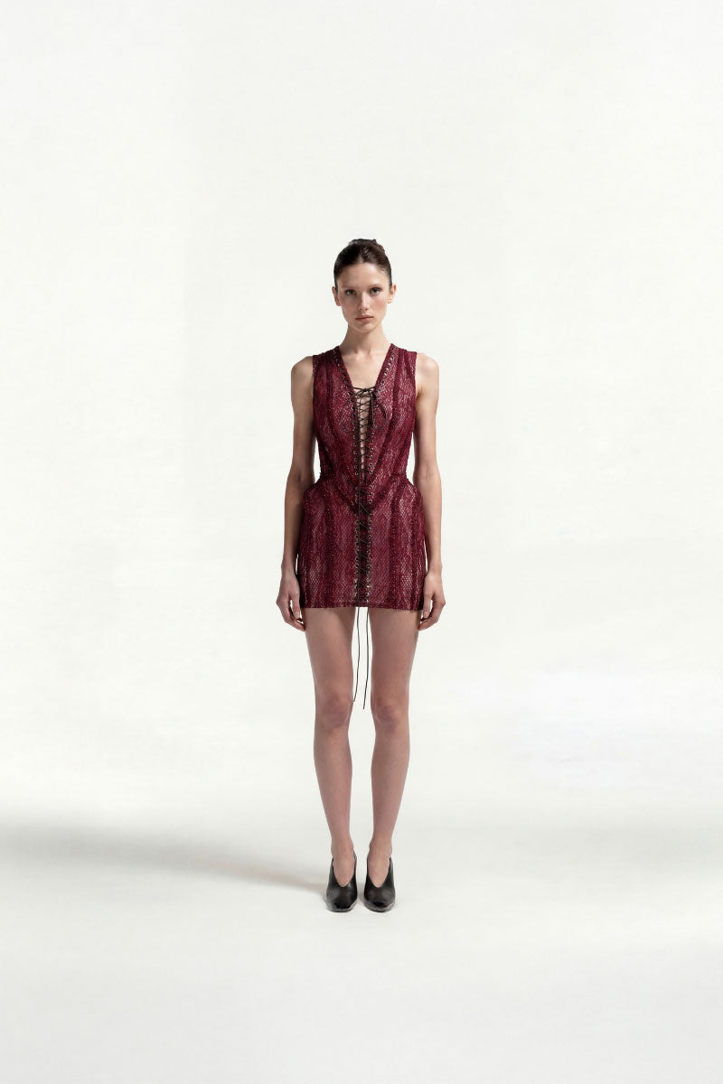 Burundy lace-up mini dress by Tayfun Kaba featuring intricate lace details and a fitted silhouette.