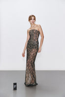Elegant lace maxi skirt from BALYKINA featuring intricate detailing and flowing fabric, perfect for a stylish look.