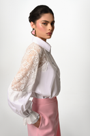 White Liya Lace Reverie Shirt made of delicate lace fabric, featuring a classic button-up design and elegant long sleeves.