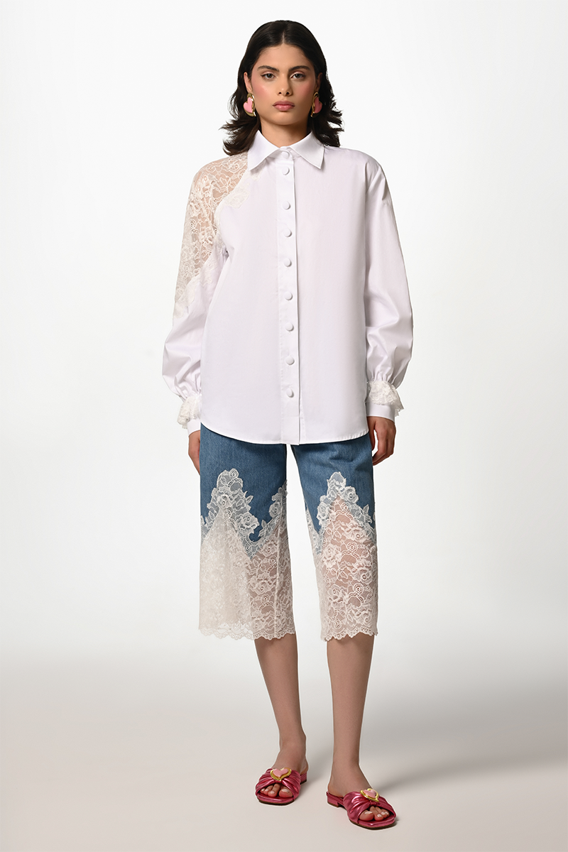 White lace Reverie shirt by Liya featuring intricate lace details and a classic shirt silhouette.