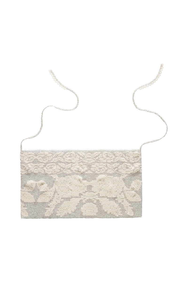 White lace hair scarf by Pura Utz, featuring delicate lace fabric perfect for stylish hair accessories.