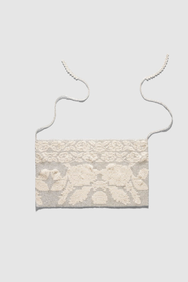 White lace hair scarf from Pura Utz, a delicate accessory with intricate lace design perfect for styling hair.