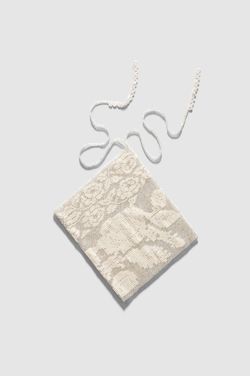 White lace scarf hair accessory by Pura Utz, featuring delicate lace fabric and versatile styling for hair embellishment.