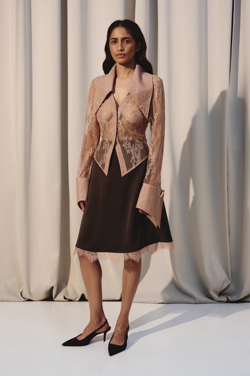 Beige laced shirt with oversized collar by Kris Marán, featuring detailed lace design and relaxed fit.