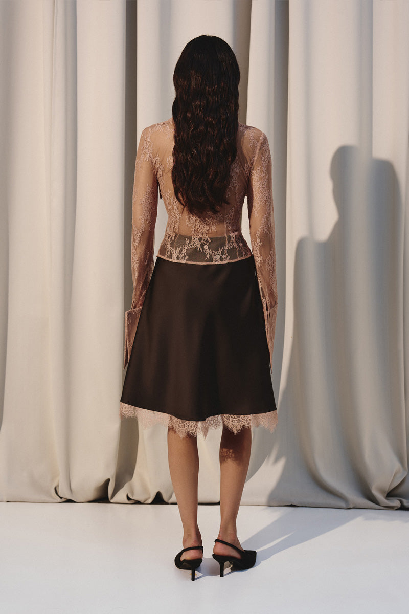 Beige laced shirt with an oversized collar by Kris Marán, stylish and elegant, shown on a model.