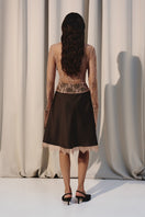 Beige laced shirt with an oversized collar by Kris Marán, stylish and elegant, shown on a model.