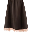 Brown silk midi skirt with elegant lace details by Kris Marán, featuring a flowing design and intricate lace accents.